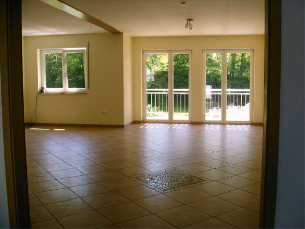 The living room on the 1st floor with a balcony