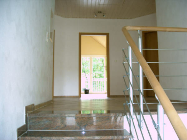Stairwell with view to the top floor and to bedroom 1